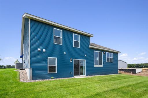 Bryant II-B Northern Craftsman rear view with Walk-out lower level at Ravine Crossing in Cottage Grove. Photo is of Model home. Options and colors may vary. Ask Sales Agent for details.