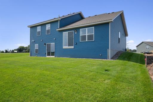 Bryant II-B Northern Craftsman rear view with Walk-out lower level at Ravine Crossing in Cottage Grove. Photo is of Model home. Options and colors may vary. Ask Sales Agent for details.