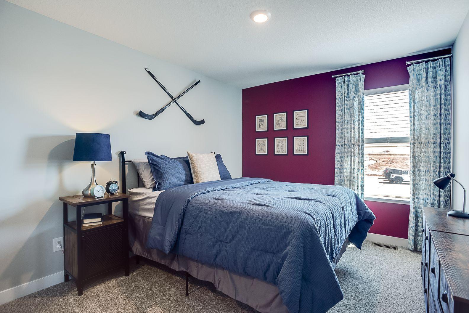 One of 3 upper-level bedrooms. Photos of model home. Colors and options may vary. Ask Sales Agent for details.