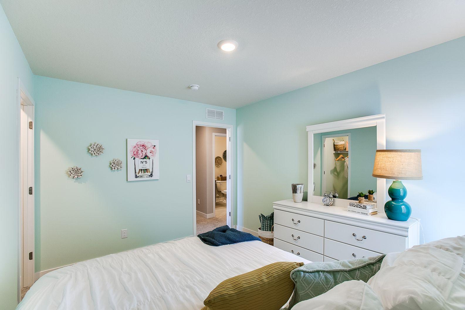 Each of the home's spacious secondary bedrooms feature well thought out window locations. Photo is of model home. Colors and options may vary. Ask Sales Agent for details.