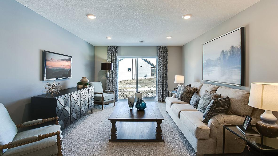 A second view of the lower level family room. Imagine the possibilities!! Photo is of model home. Colors and options may vary. Ask Sales Agent for details.