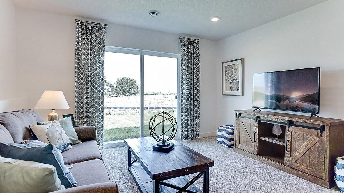 View of the lower level family room...Just a tremendous use of space!! Photo is of model home. Colors and options may vary. Ask Sales Agent for details.