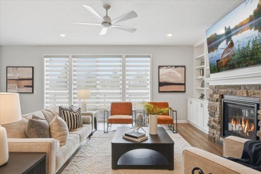 The oversized glass sliding doors leading to the deck have custom blinds for light control.