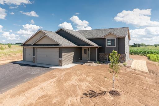 Photos are of a previously completed home with similar design and features. Actual selections, finishes, and materials may vary based on buyer choices and availability.
