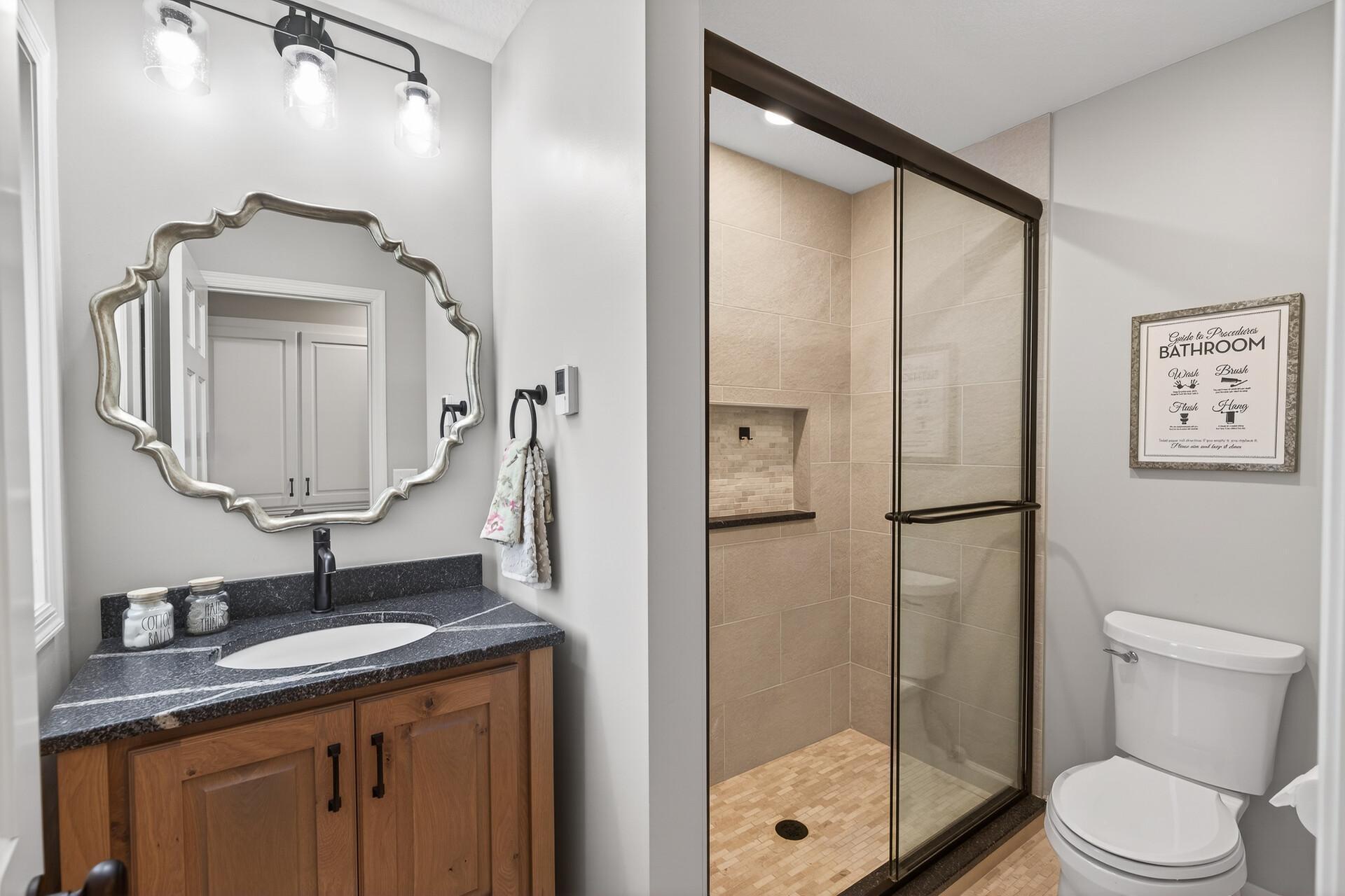 Practical main-level bath with a tiled walk-in shower.