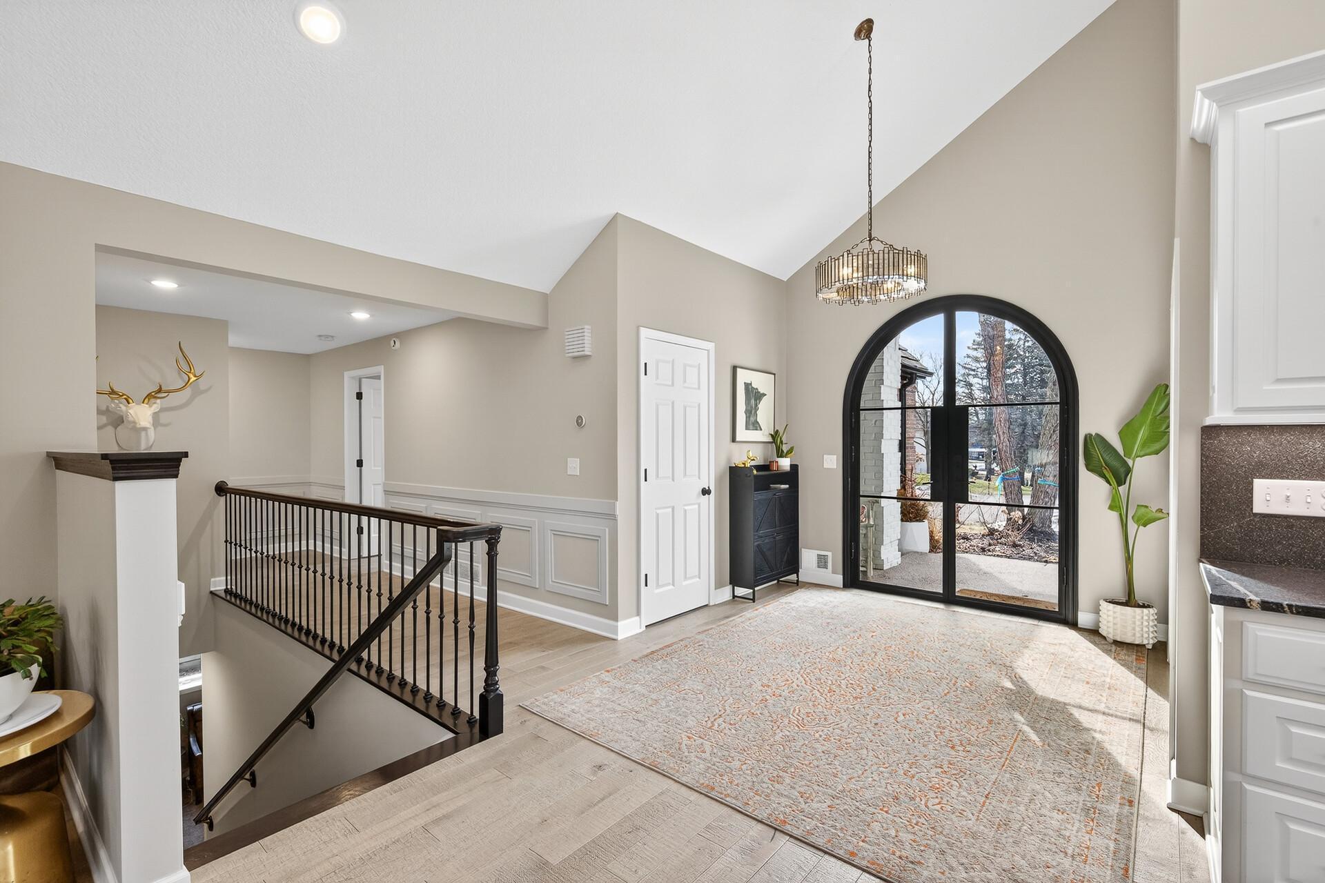 This entry unfolds into a spectacular, open-concept layout—blending living, dining, and kitchen into one cohesive space.