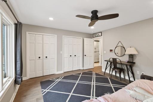 Maximize organization with two separate closets in this bedroom.