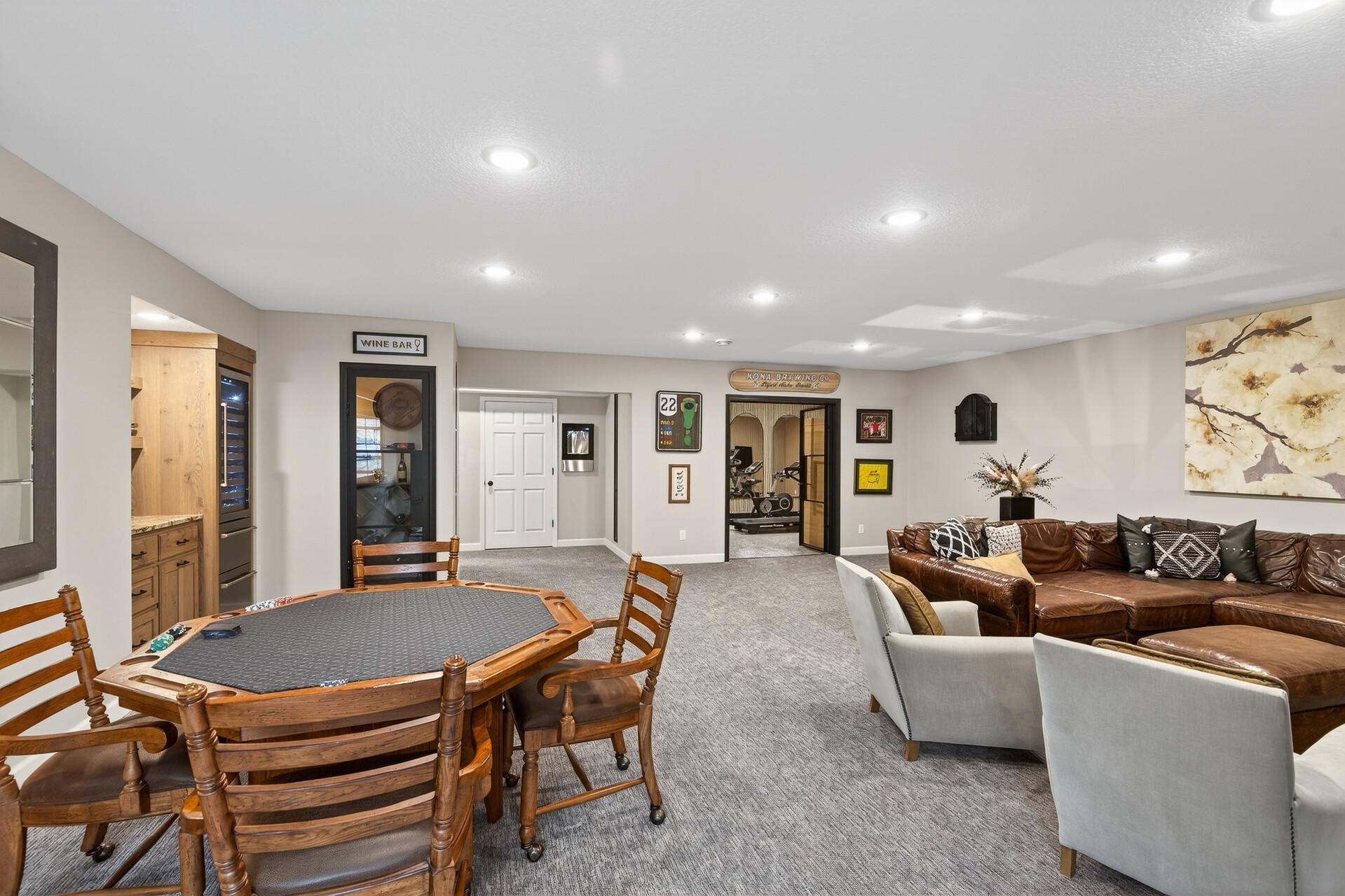 From the patio entrance, experience a fluid lower-level design that lead to a premier fitness room.