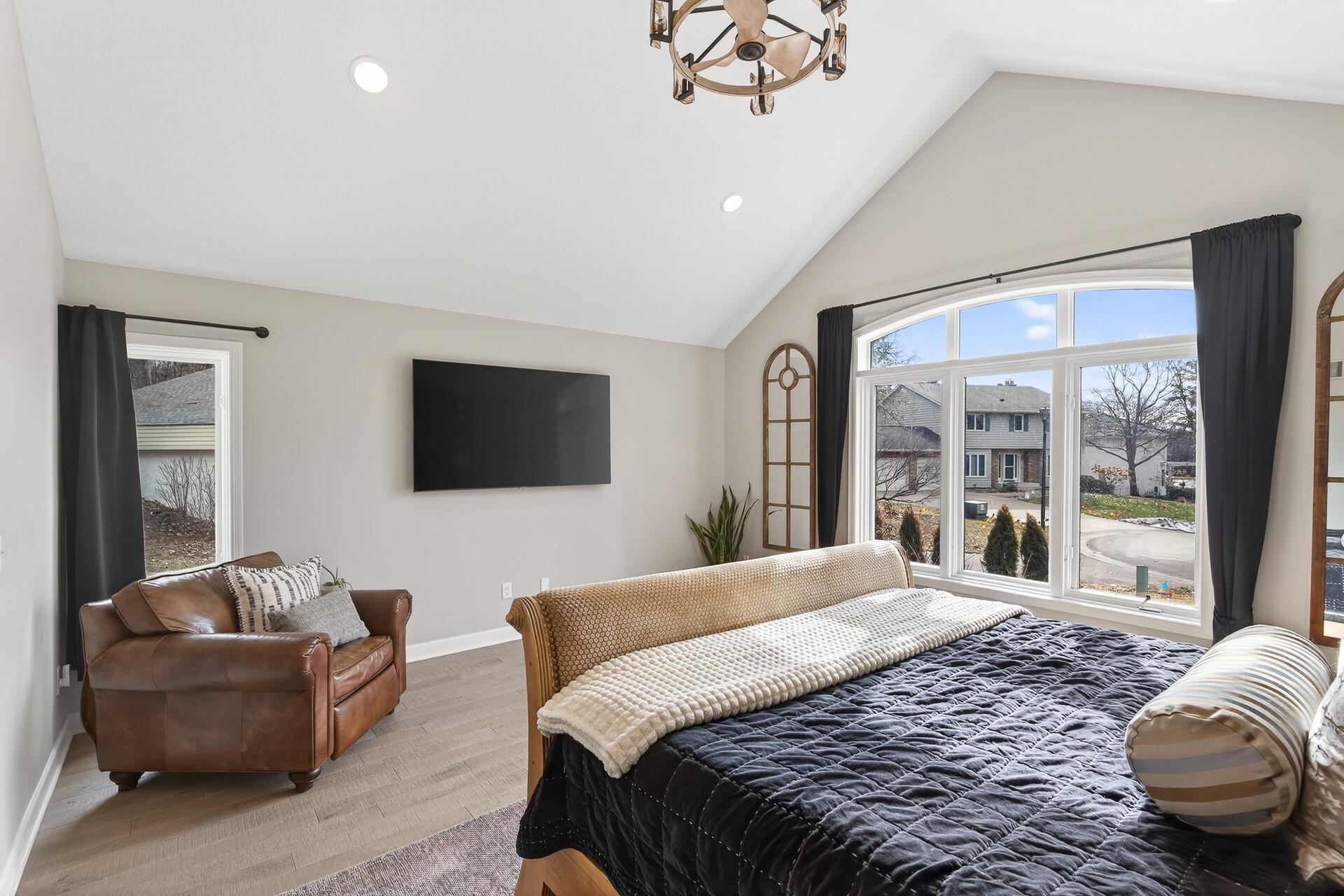 Wake up to peaceful cul-de-sac views through oversized windows that bathe the primary suite in natural light.