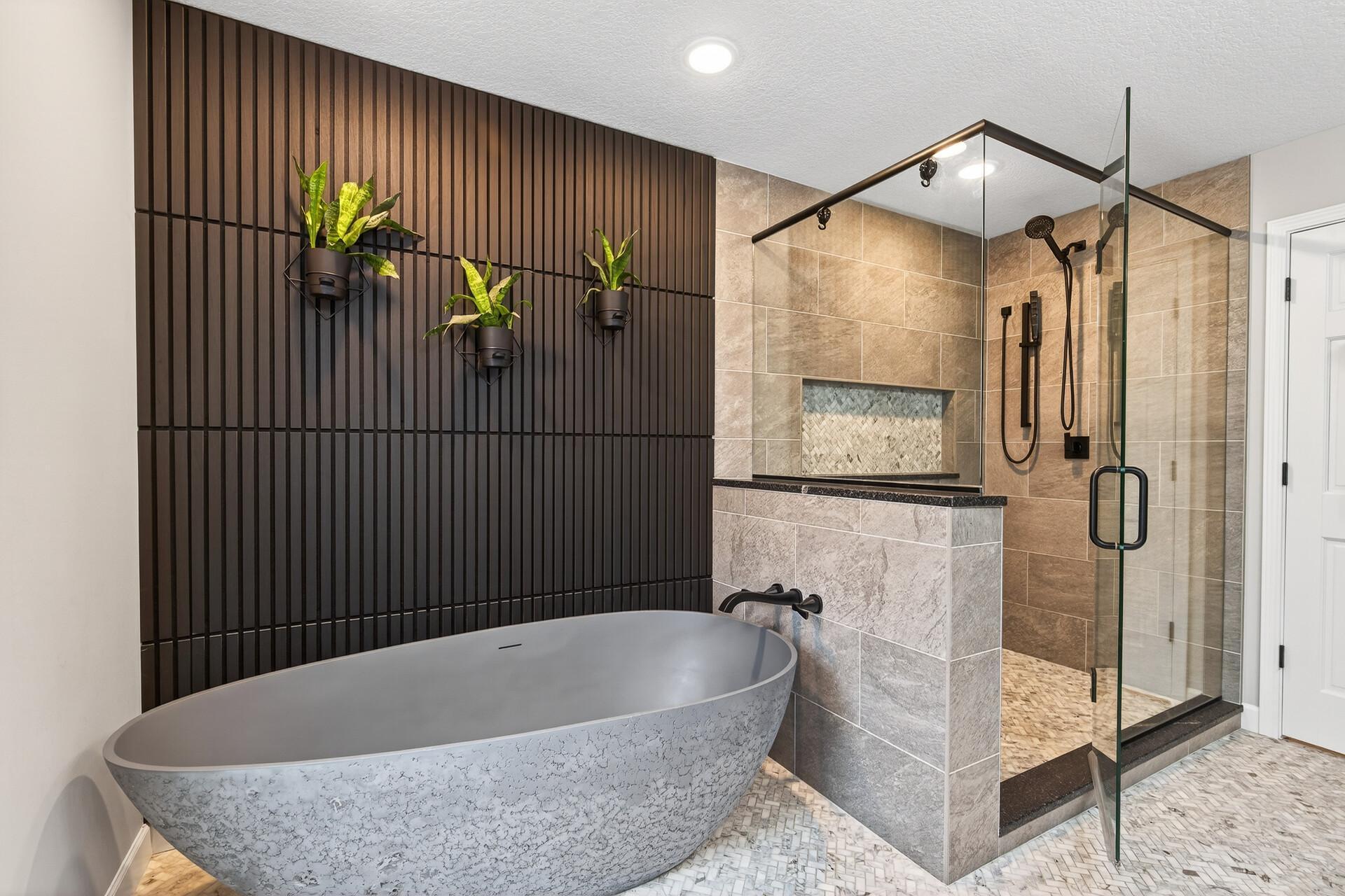 Indulge in the designer ensuite, complete with a freestanding soaking tub and a spacious glass-enclosed shower.