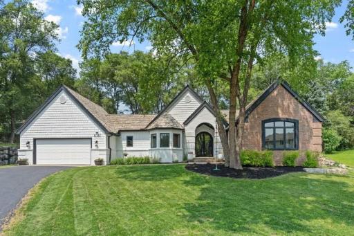 6141 Sherman Circle. This rambler has been meticulously updated, combining sleek designer finishes with the timeless ease of an open, flowing layout.