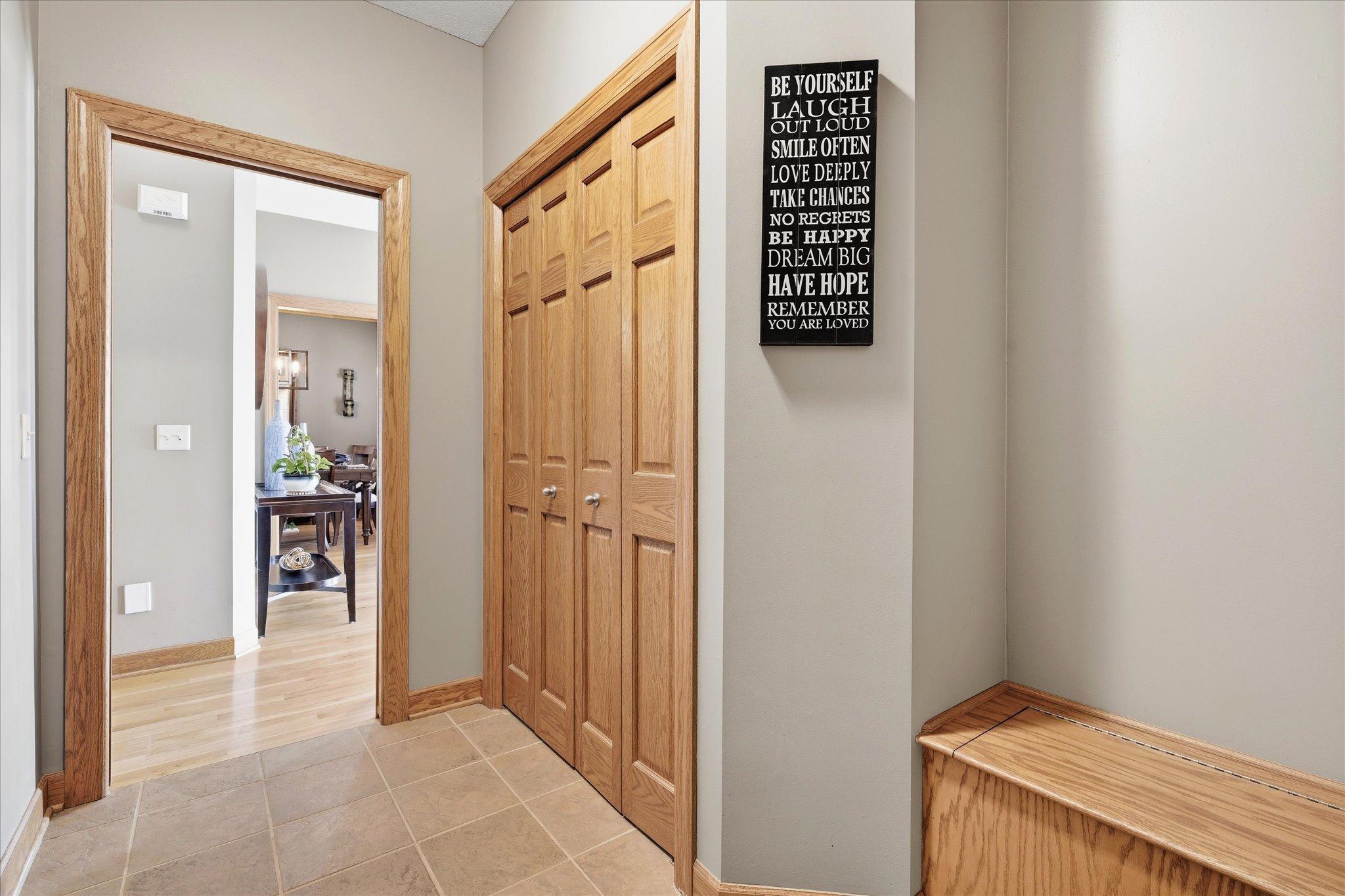 Garage entry featuring a built-in bench, creating a convenient drop zone for shoes, bags, and everyday essentials.