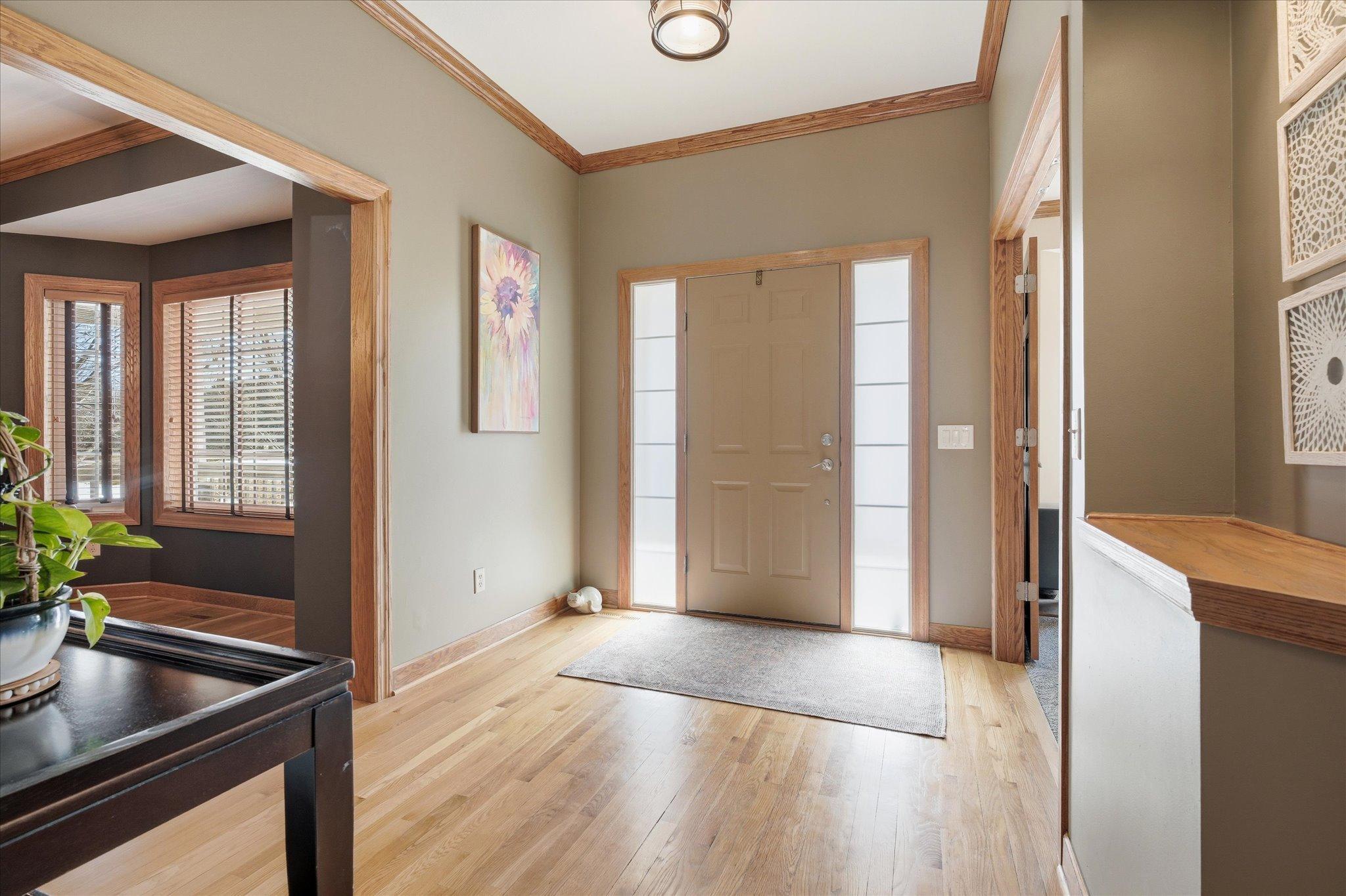 Grand and spacious foyer entry designed to greet guests with an open, airy feel and an immediate sense of comfort.