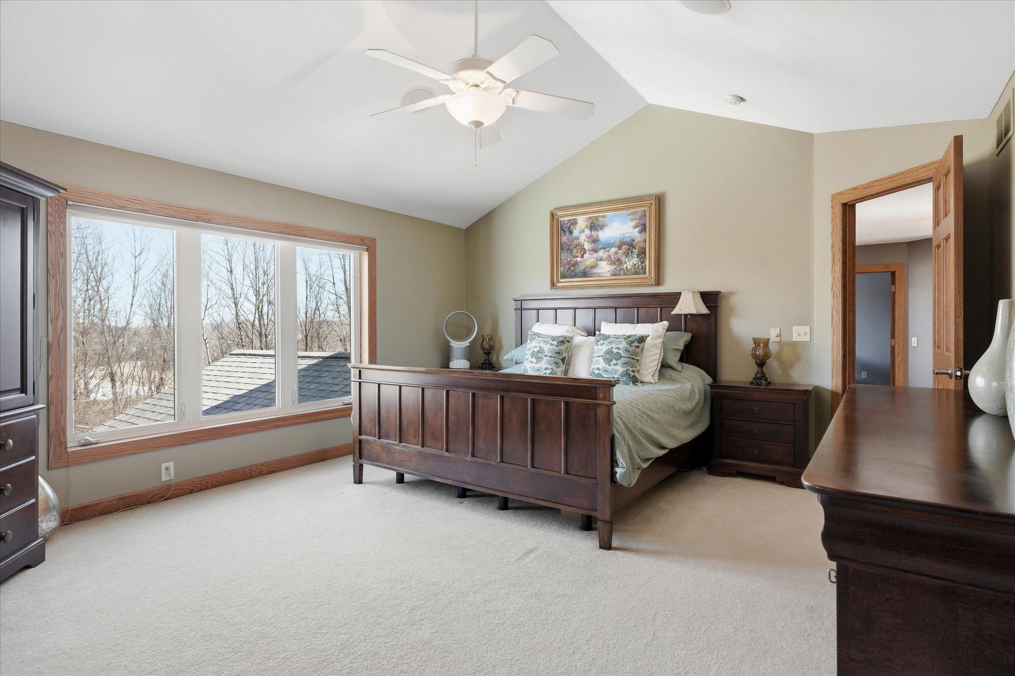 Primary suite with beautiful vaulted ceilings, enhancing the sense of space and natural light for a bright and comfortable retreat.