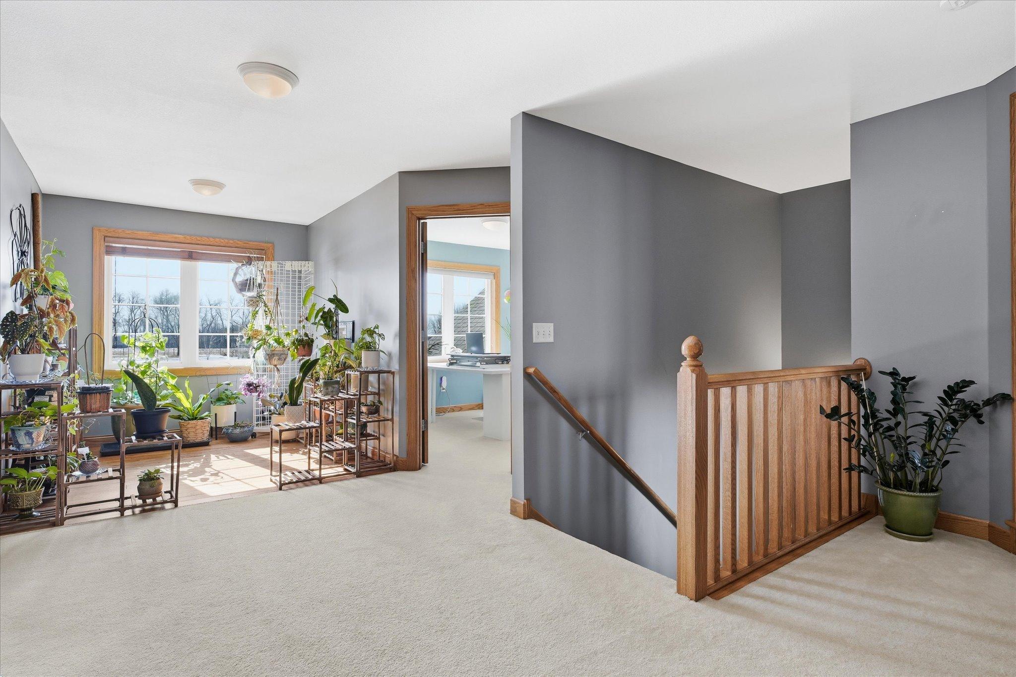 Upper-level loft offering a versatile space ideal for a small living area, reading nook, or additional family lounge.