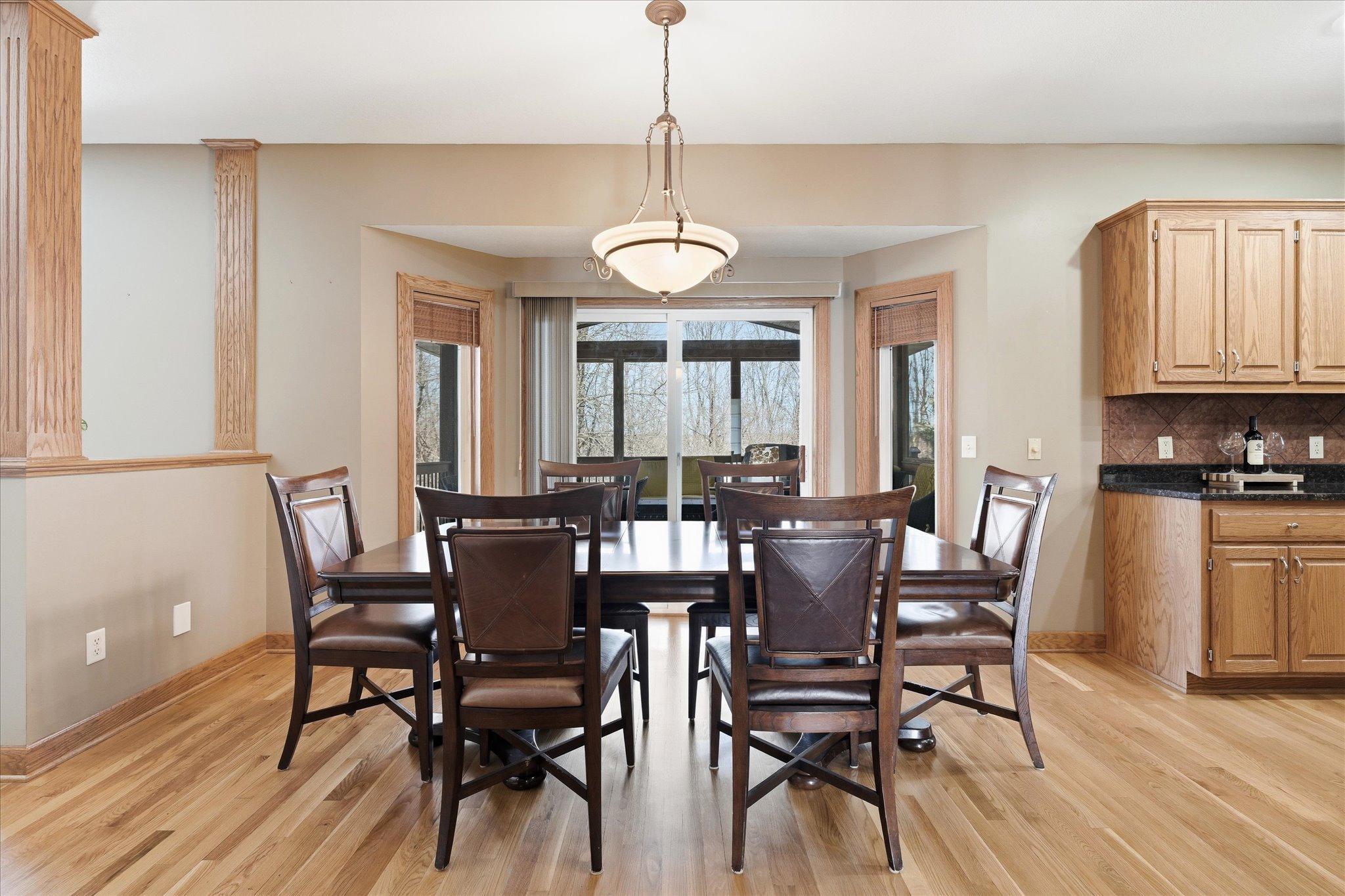 Informal dining room positioned next to the three-season porch.
