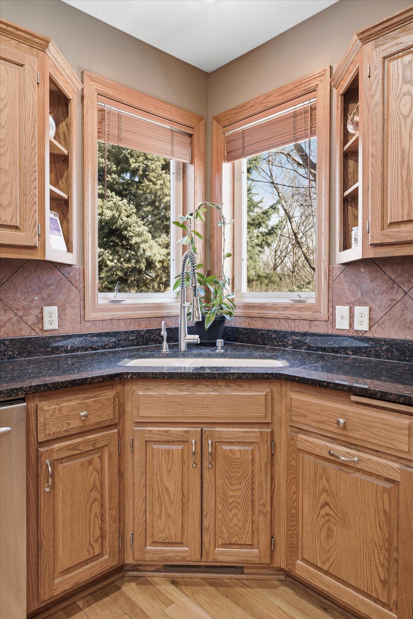Window above the corner sink brings in beautiful natural light.
