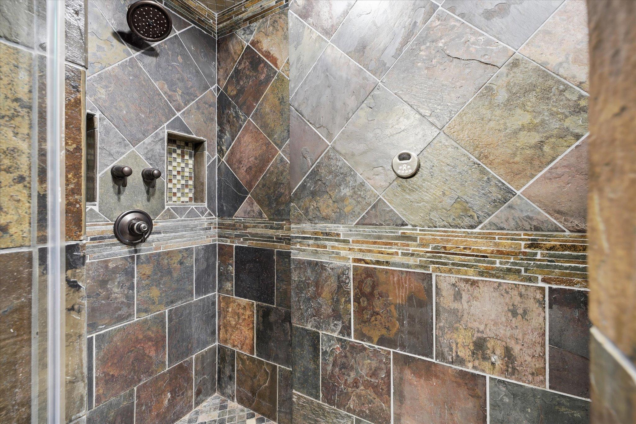 Rich tilework and quality finishes create a spa-like experience.