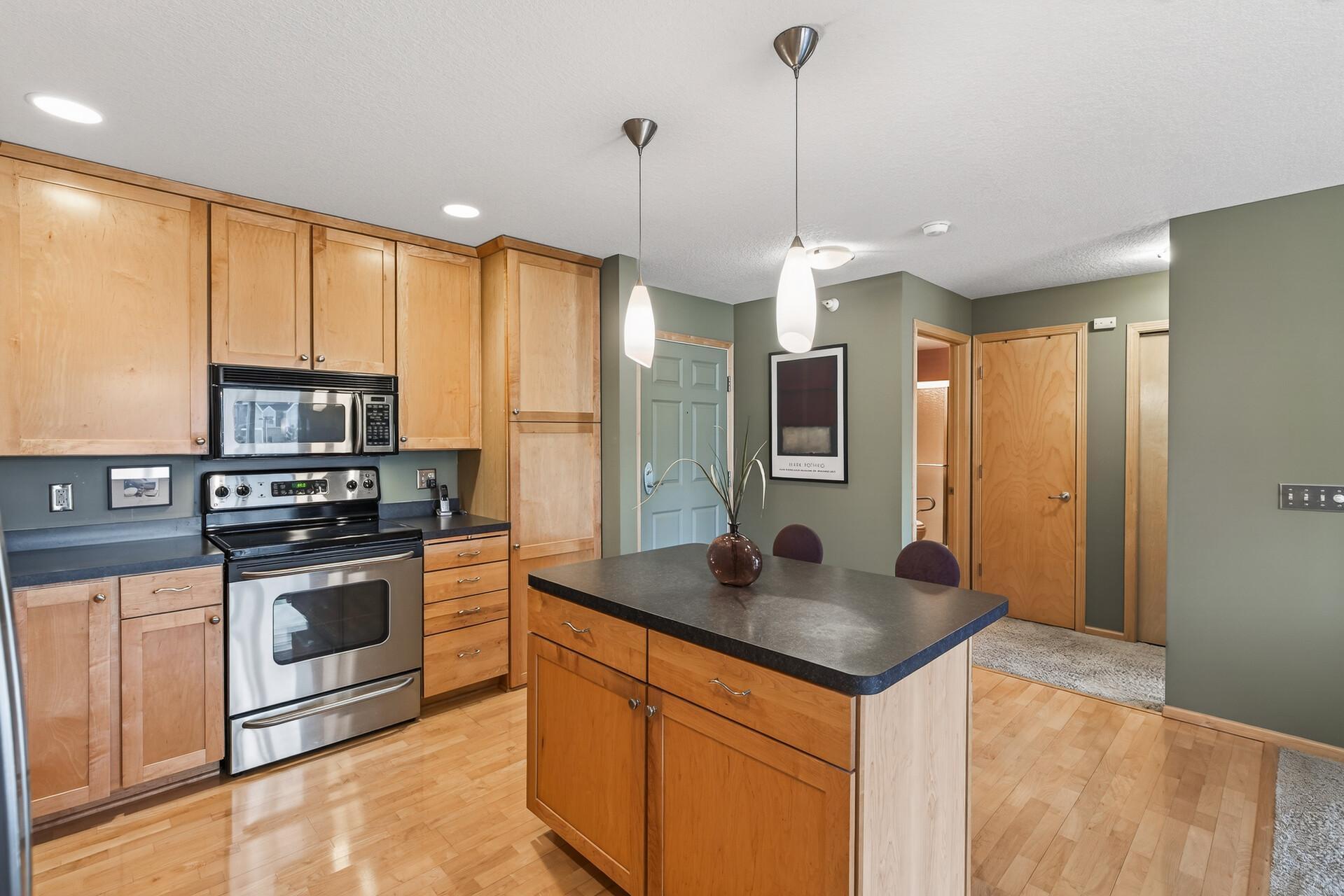 Hardwood floor in the kitchen and entry.