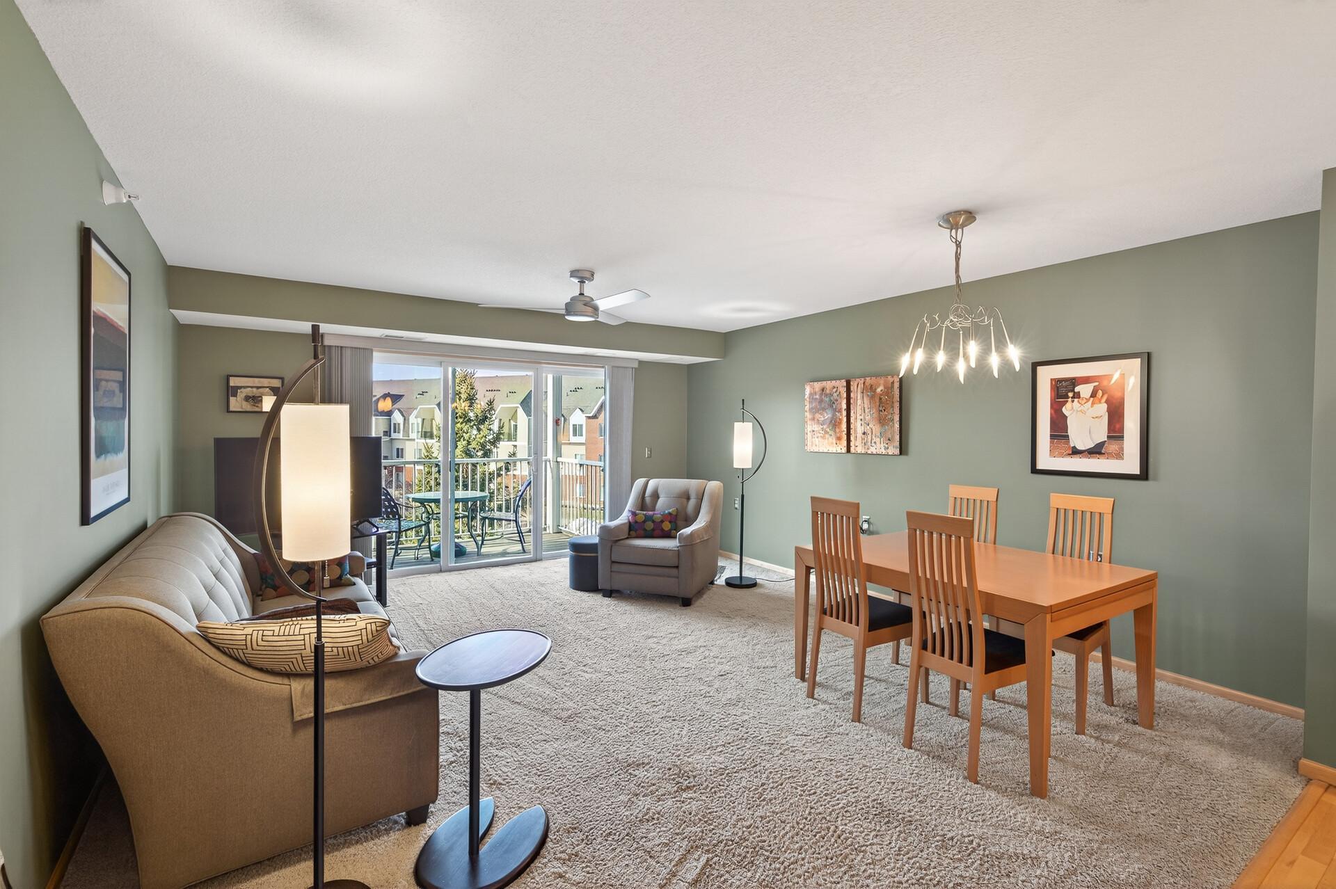 The large patio door lets sunlight flood in.