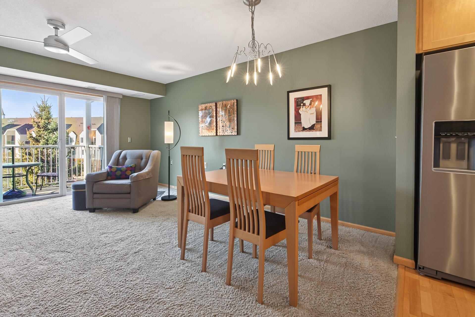 Contemporary chandelier is the highlight of the dining area.