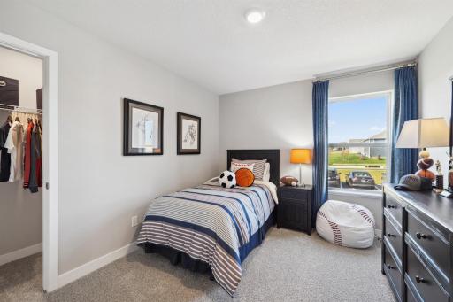 In addition to the primary bedroom, the home's upper level also includes these two additional bedrooms, and another full bathroom just adjacent to each! Photo of model, colors and options will vary.