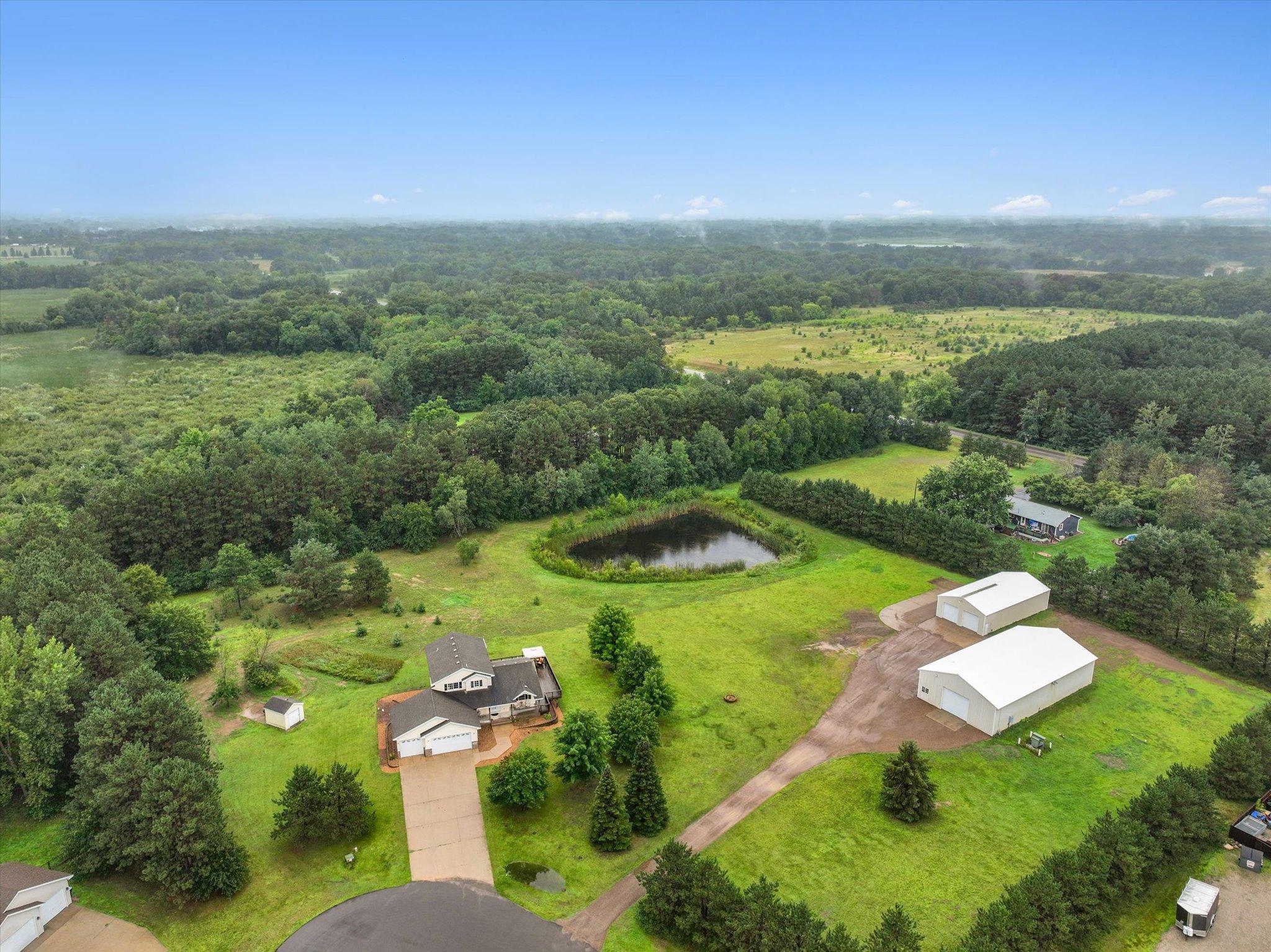 Set on approximately 6.17 acres at the end of a cul-de-sac, this property offers a private setting with mature trees, open land, and flexible residential and business-use potential.