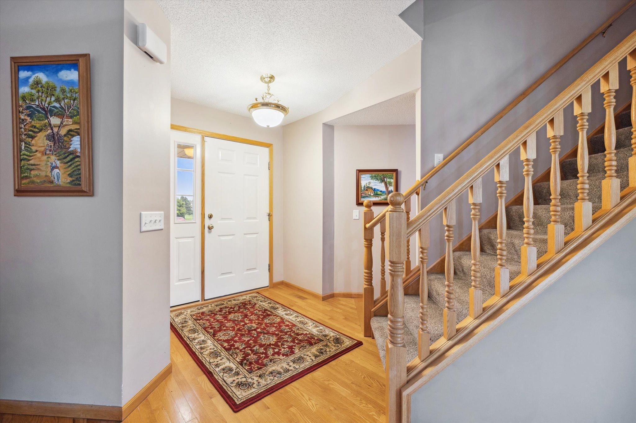 Spacious front entry features an open staircase and direct access to the home’s main living areas.