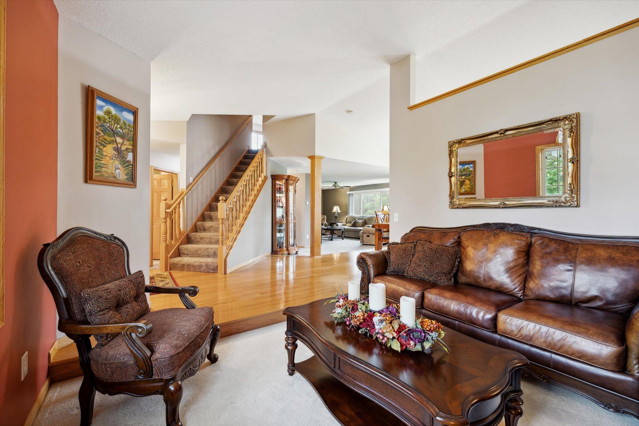 Separate main-level living area provides additional flexible space for sitting, conversation, or other use without closing off the layout.