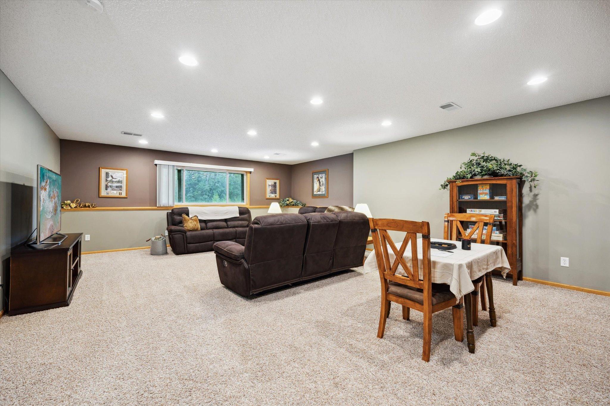 Finished lower-level family and recreation area offers expansive open space with flexibility for gathering, entertainment, or extended living arrangements.