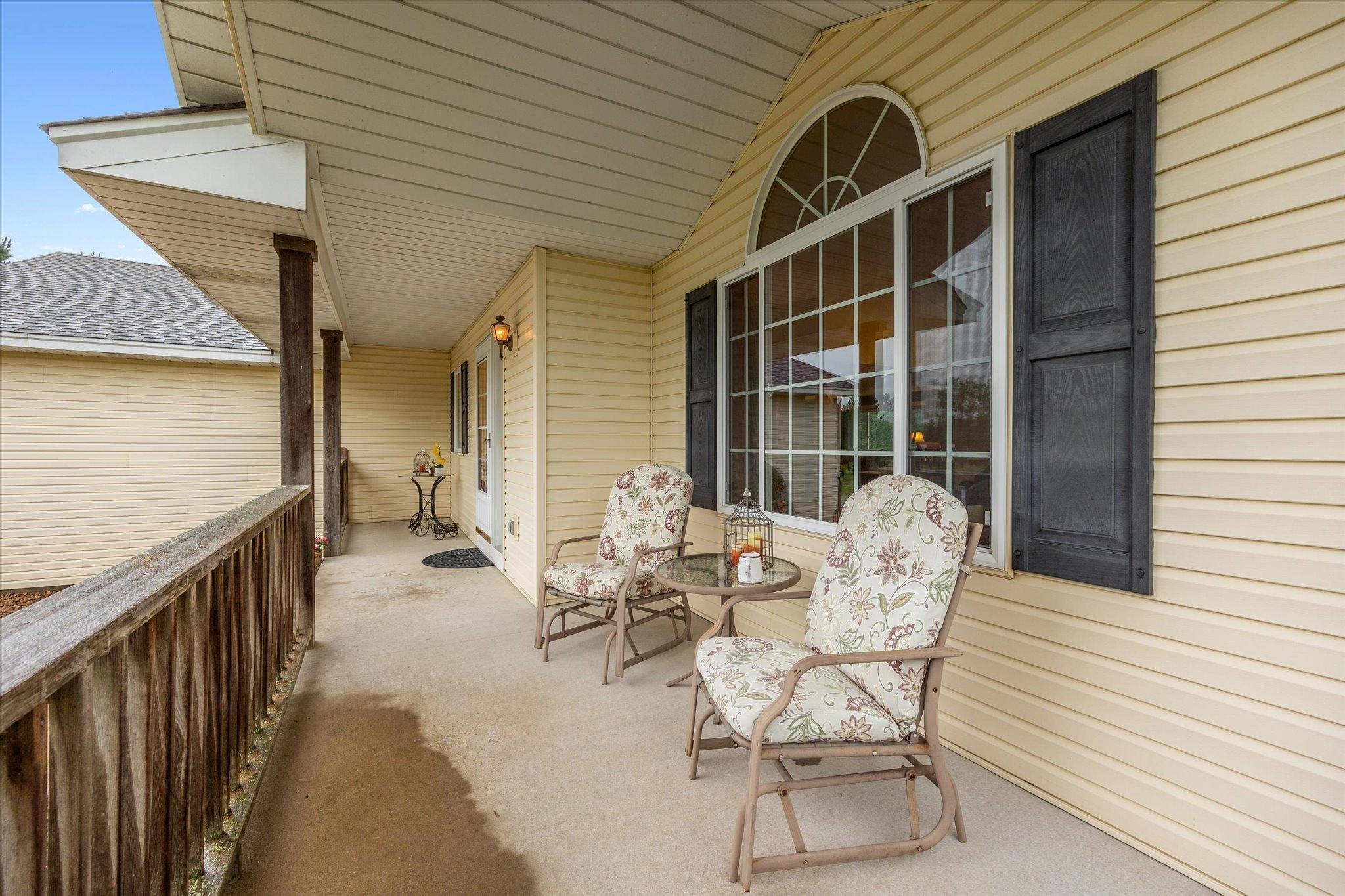 Front porch offers a welcoming entry and an additional outdoor sitting area.