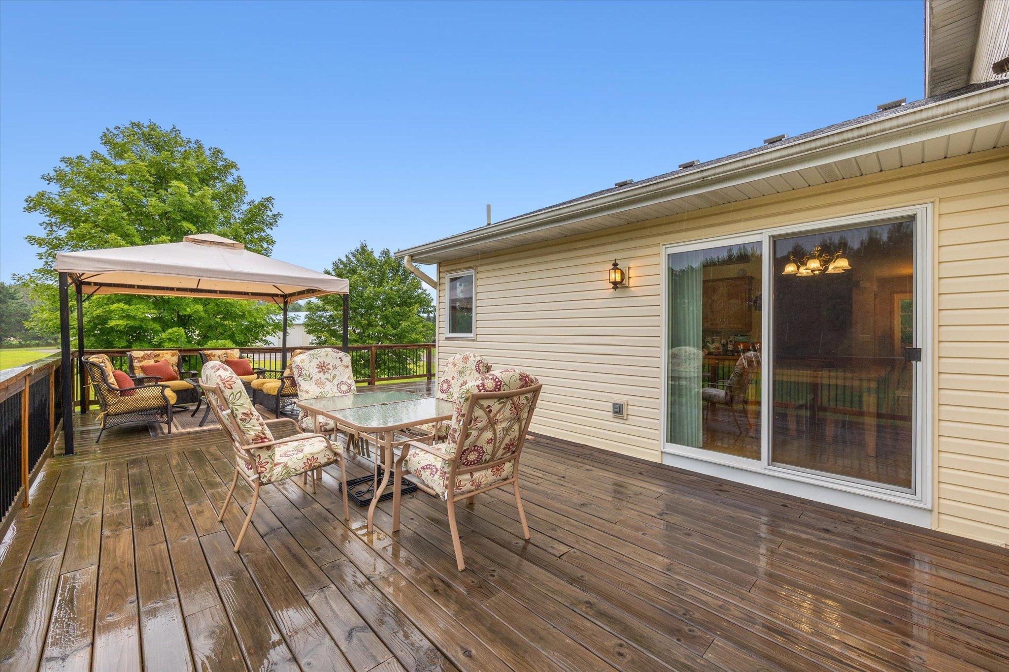 Deck area offers generous space for outdoor dining and gathering with direct access from the home.