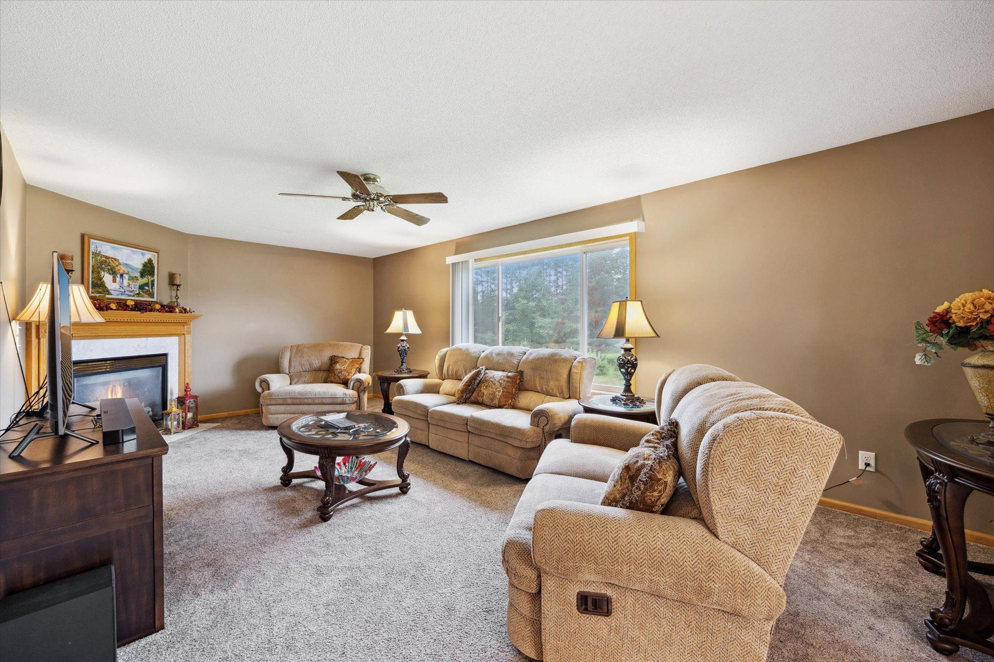 Main living area offers generous room for seating and everyday living with large windows overlooking the property.