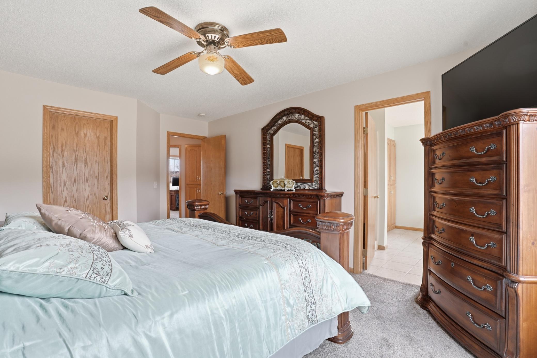 Primary suite view highlighting ample space and private access to the ensuite bath.