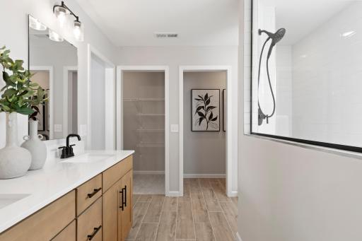 Owner's bathroom with His & Her closets and separate water closet