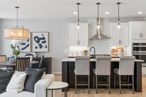 Kitchen with seating at center island and cafeeat-in cafe area