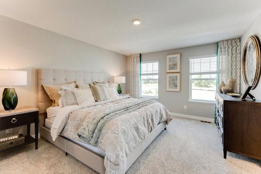 Main bedroom fit a king size bed easily.*Photos are of a previously staged model*