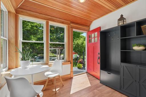 Welcome in! Enjoy mornings or evenings on this cozy porch, with sun drenched light and heated floor.
