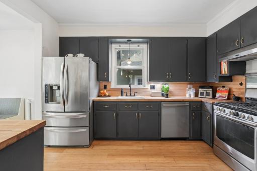 Enjoy your mornings in the eat-in kitchen with wooden countertops, stainless steel appliances, and genourous natural light.