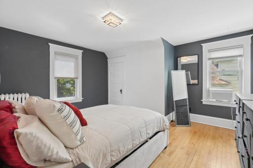 The upper level offers three bedrooms with a full bath, and a bonus room with porch space overlooking the backyard.