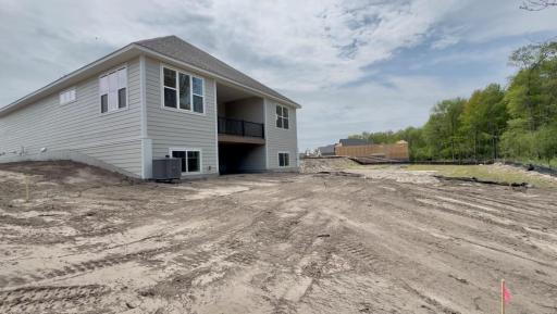 The covered back deck offers outdoor use, rain or shine!