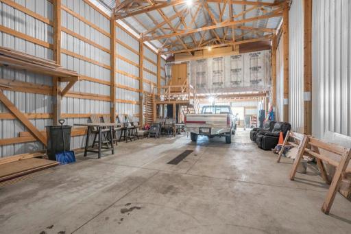 Inside the detached building. There is heat in the 38x35 shop, no AC, electric throughout all 3 shops, and rough plumbing for bathroom under loft.