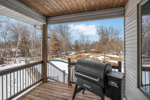 Covered deck off the dining room leads to the backyard.
