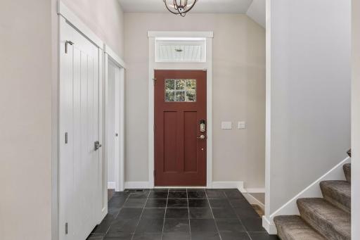A welcoming front entrance with coat closet & attractive slate tile.