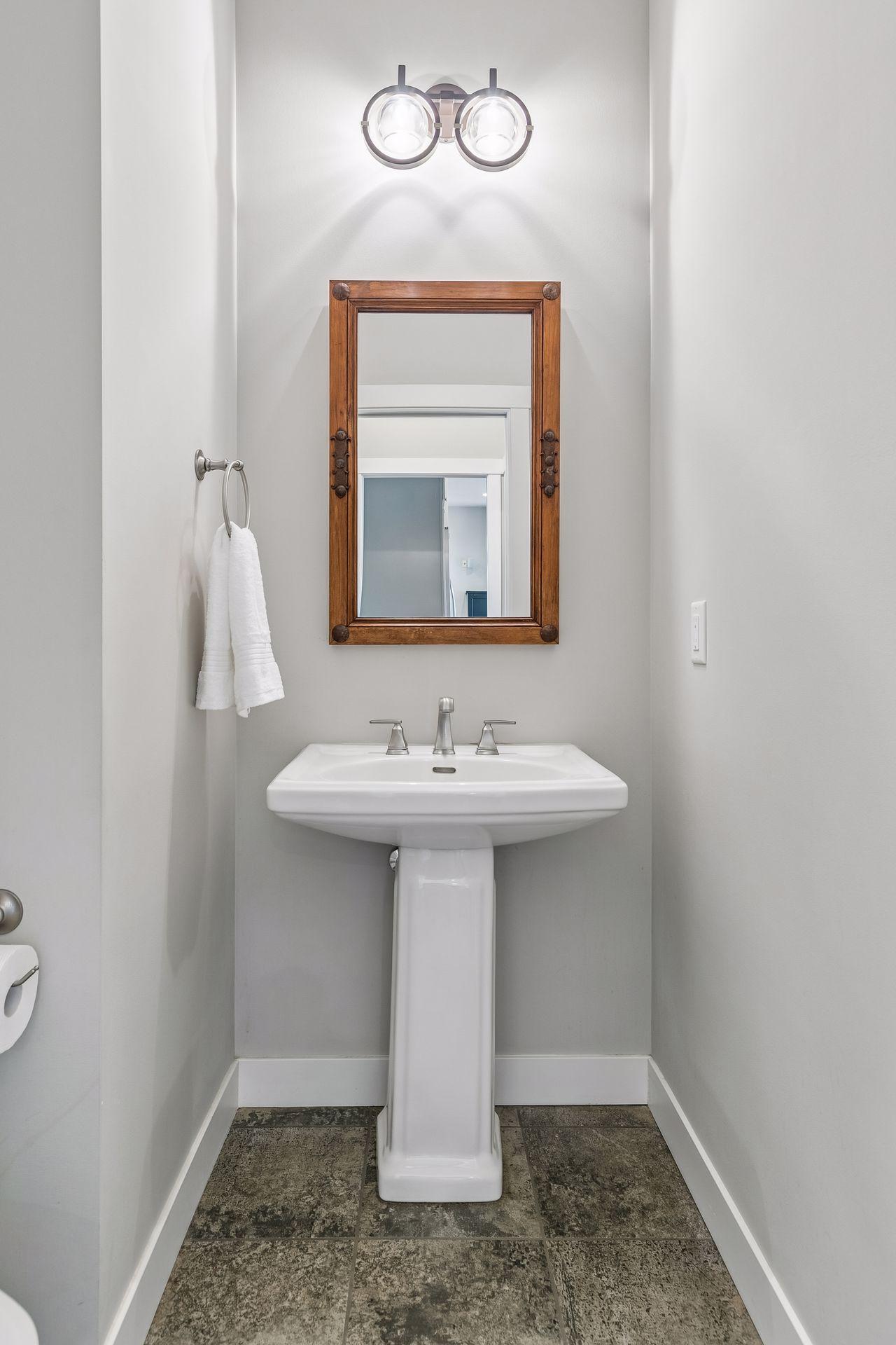 Convenient 1/2 bath off of the kitchen & mudroom.