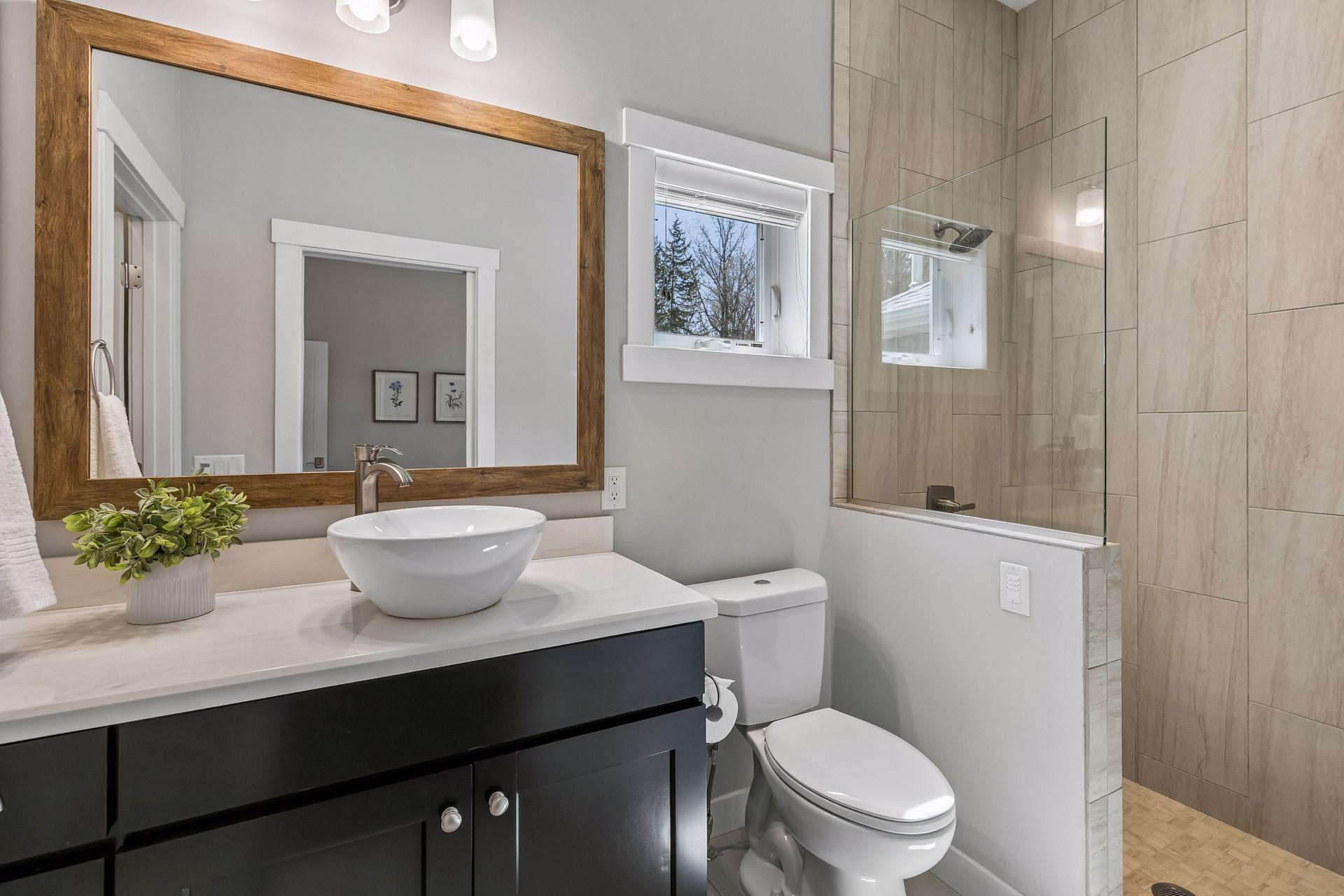 Main level guest room includes private 3/4 bath with walk-in shower & a walk-in closet!