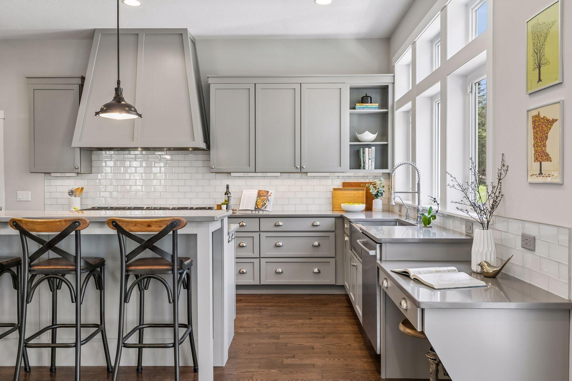 Abundant & attractive kitchen cabinetry with timeless backsplash.