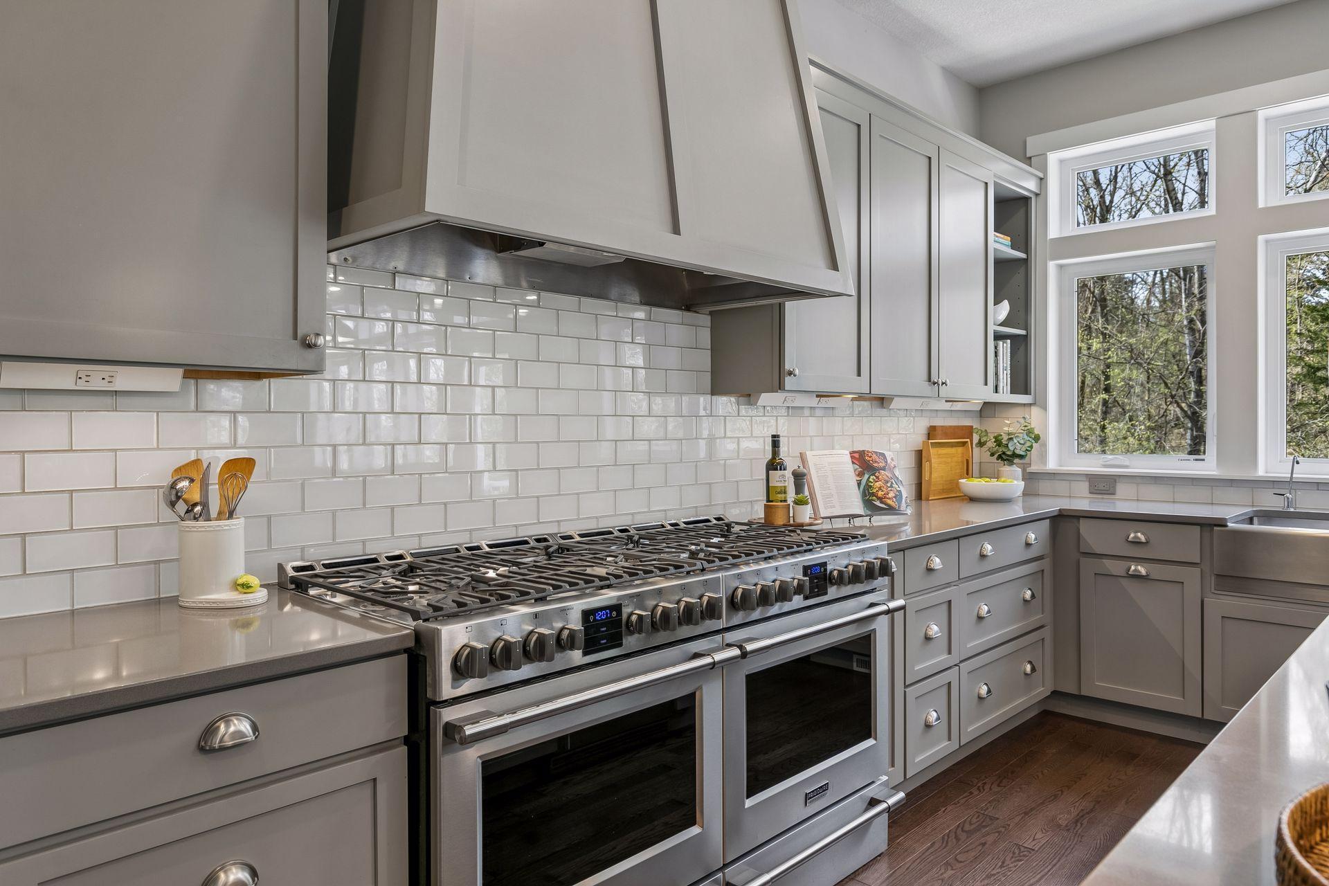 Not one but two ovens & gas ranges with custom wood hood - let the master chef begin!