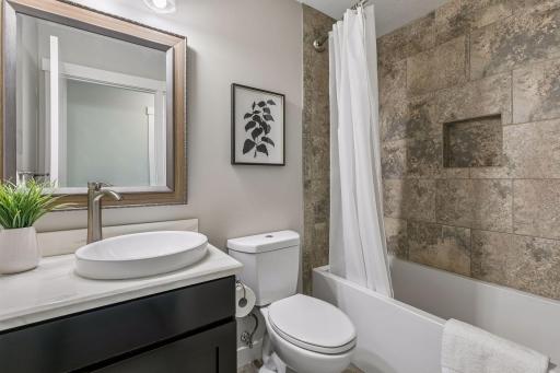 Full bath outside of the 2nd & 3rd bedrooms on the upper level.