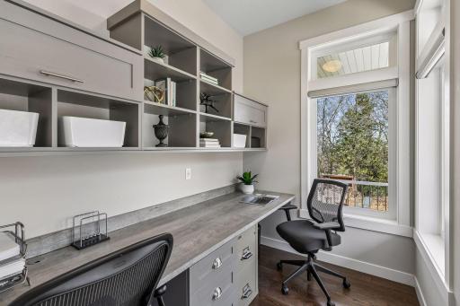 A California Closets designed pocket office on the main level just off of the front entrance.